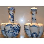 A pair of Chinese blue and white porcelain crocus vases the conjoined 5 section bodies with tall