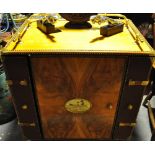 A Cuban walnut humidor cabinet with a three quarter brass galleried top over studded wood bound tan