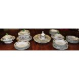 An extensive Wedgwood Bridgwater pattern dinner service with floral and fruit borders,