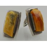 Two pairs of silver and Baltic amber cufflinks.