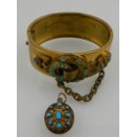 An unusual Victorian gilt metal and turquoise bangle with buckle decoration, together with a