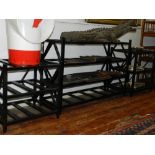 A set of three ebonised conservatory shelves.