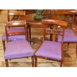 Two pairs of 19th century mahogany dining chairs, having purple upholstered seats.