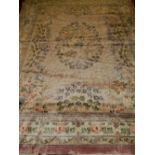 A Chinese silk pink ground carpet, decorated with floral design to centre, within many borders,