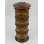 A wooden spice tower, of four sections. H: 19cm
