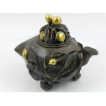 A Chinese bronze incense burner, modelled as fruit, having branches and fruit to body, the lid