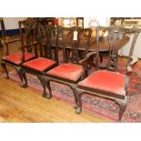 A set of eight Chippendale mahogany dinning chairs, having carved and pierced backrests and red