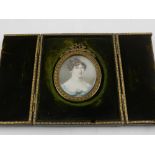 19th century Continental school, a portrait miniature of a finely dressed lady, oil on ivory, fitted