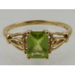 A 9 carat yellow gold and green citrine ring.