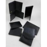 Celine, Paris. A ladies wallet, together with seven various black leather wallets.