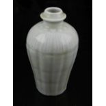 A Chinese celadon vase, having ribbed body, H.14cm