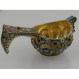 A Russian silver gilt and champleve enamel kovsh, polychrome decorated and inset with various semi-