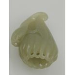 A Chinese jade carving, in the form of a flower.