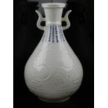 A Chinese white ground twin-handled baluster vase, decorated with phoenixes and stylised flowers,