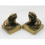Two Chinese bronze seals, the finials modelled as dogs of Fo. H.10cm (largest) (2)
