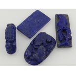 Six fragments of lapis lazuli carvings.