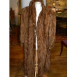 A ladies long brown mink fur jacket. approx. size L.