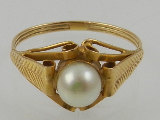 An 18 carat yellow gold and pearl ring, the pearl set in an ornately curled mount. - Image 2 of 2