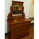 An Edwardian mahogany dressing chest, the mirror having two short drawers below, the chest having