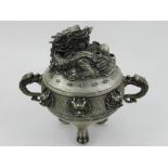 A Chinese white metal incense burner, having twin dragon handles and dogs of Fo masks to waist