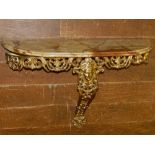 A 20th century gilt metal wall hanging console table, in the Neo-Classical taste, having onyx top.