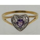 A 9 carat yellow gold, diamond, and amethyst heart-shaped ring.