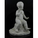 A Copeland 19th century parian figure of an infant sitting on a rock. H.23cm