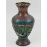 A plique a jour baluster vase, having cartouche to each side enamelled with flowers, H.15cm