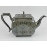 A 19th century style silver plated teapot, engraved with scrolling foliage.
