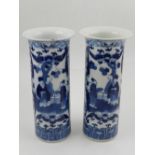 A pair of Chinese cylindrical trumpet vases, decorated with a continuous scene of courtiers
