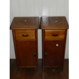 A pair of 20th century stained pine bedside pot cupboards, having single drawer to top, raised on