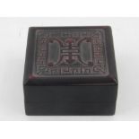 A Chinese soapstone seal, contained in a hardstone box. W.7cm