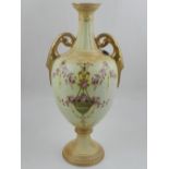 A twin-handled Crown Devon blush ivory vase, with floral decoration, H. 35cm.