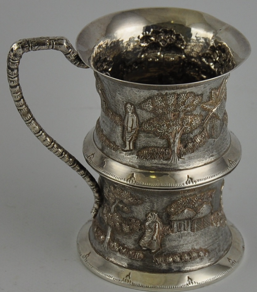 A solid silver Indian tankard 19th Century with snake charmer design 10oz