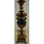 A large gilt metal and composite table lamp in the Classical style, H.