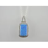 A silver cubic zirconia and opalite pendant necklace