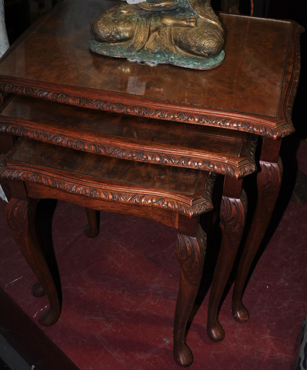 A nest of three walnut tables,