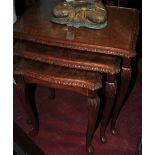 A nest of three walnut tables,