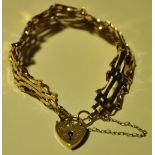 A 9ct gold gate link bracelet with padlock clasp