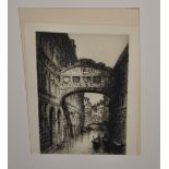 A framed monochrome lithograph of 'The Bridge of Sighs' in Venice, signed bottom right J.