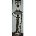 A 19th century brass oil lamp later converted to electricity, with corinthiam column base.
