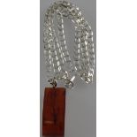 A genuine vintage natural Baltic amber pendant on a silver chain