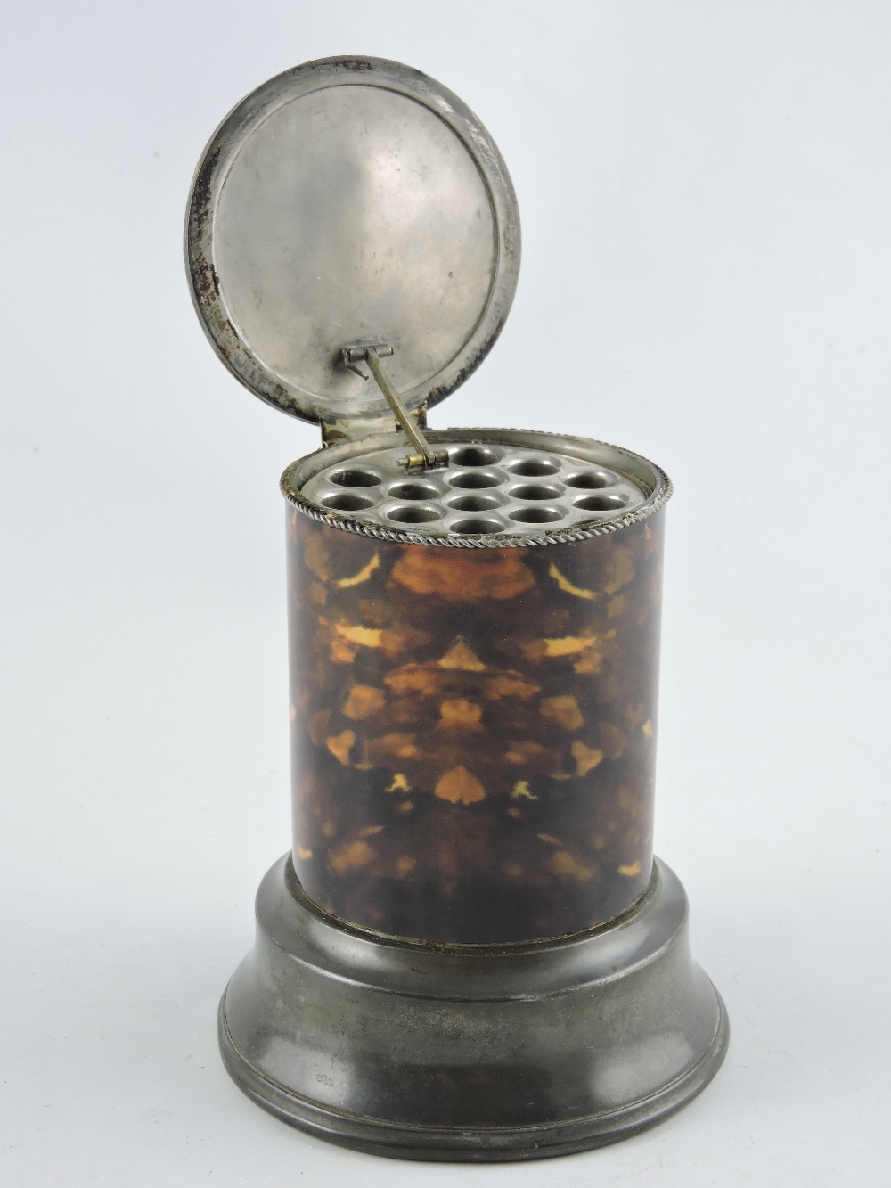 A faux tortoiseshell desk cheroot dispenser