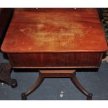 A mahogany sewing box with rising lid on four splayed feet,