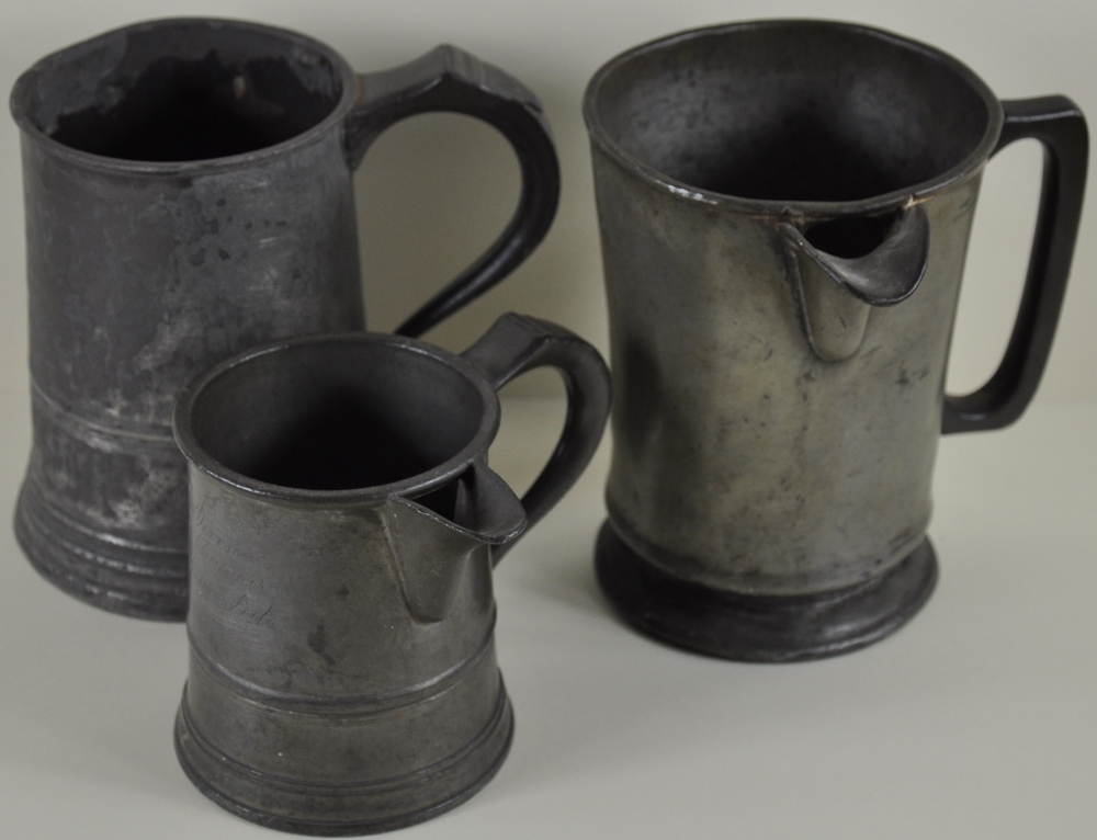 A Victorian quart measure with pouring spout, together with a similar pint measure,