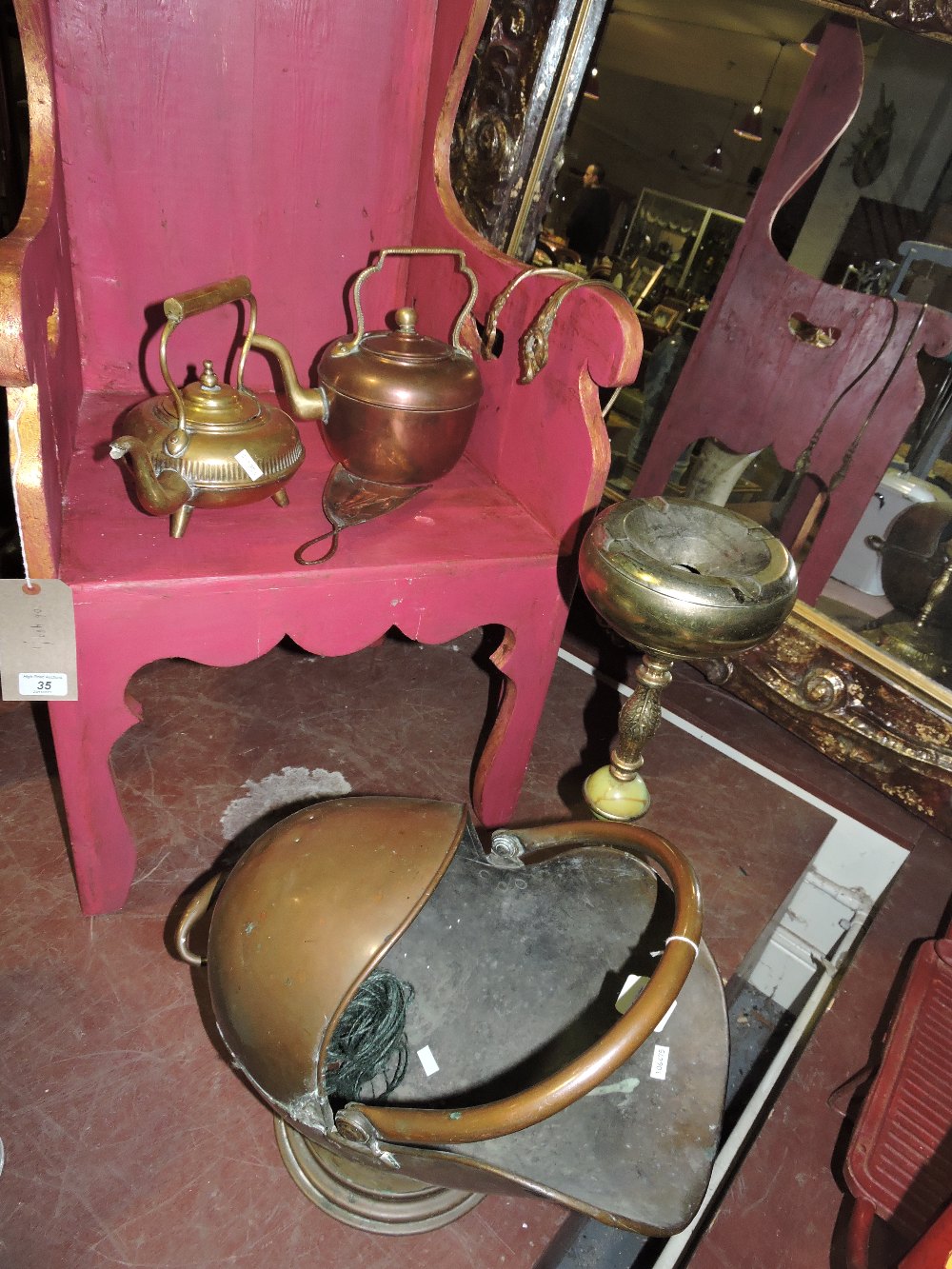 A collection of brass and copper items to include coal scuttle, ash tray etc.