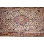 A handmade wool Persian faun ground rug,