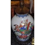A Chinese baluster shaped vase, decorated with peacocks among peony, on pierced wood base,