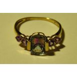 A 9ct yellow gold ring set with amethyst and a mystic topaz