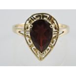 A vintage 9ct gold garnet teardrop ring